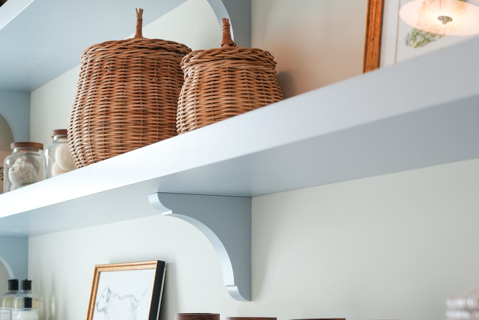 Baskets on a painted kitchen shelf at Four Tails