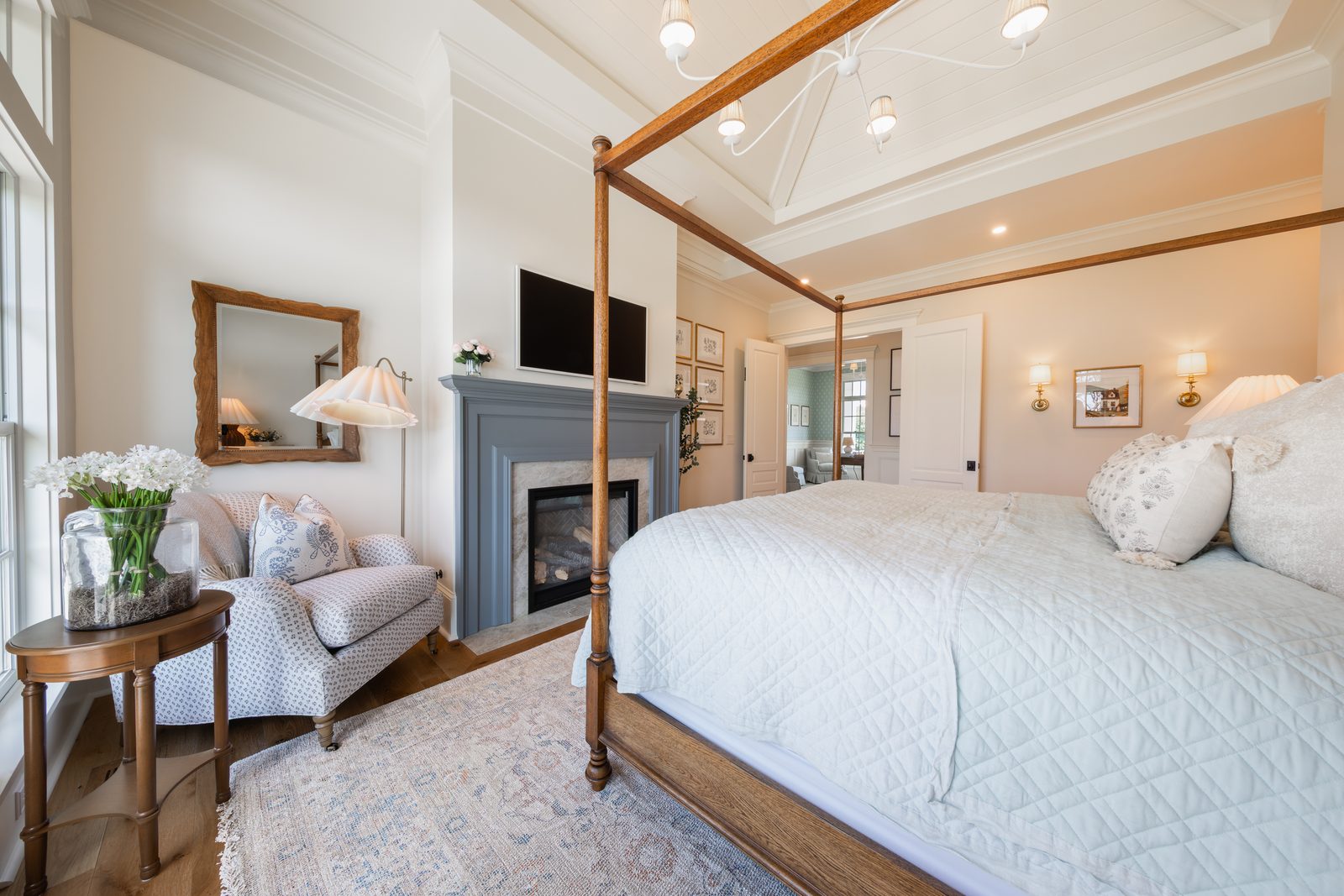 The primary bedroom with a canopy bed