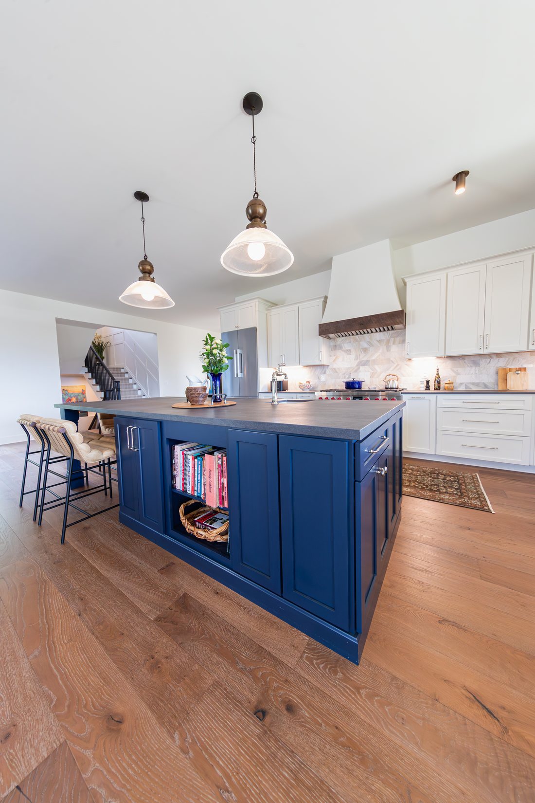 A kitchen island and pendants in a Total Build home