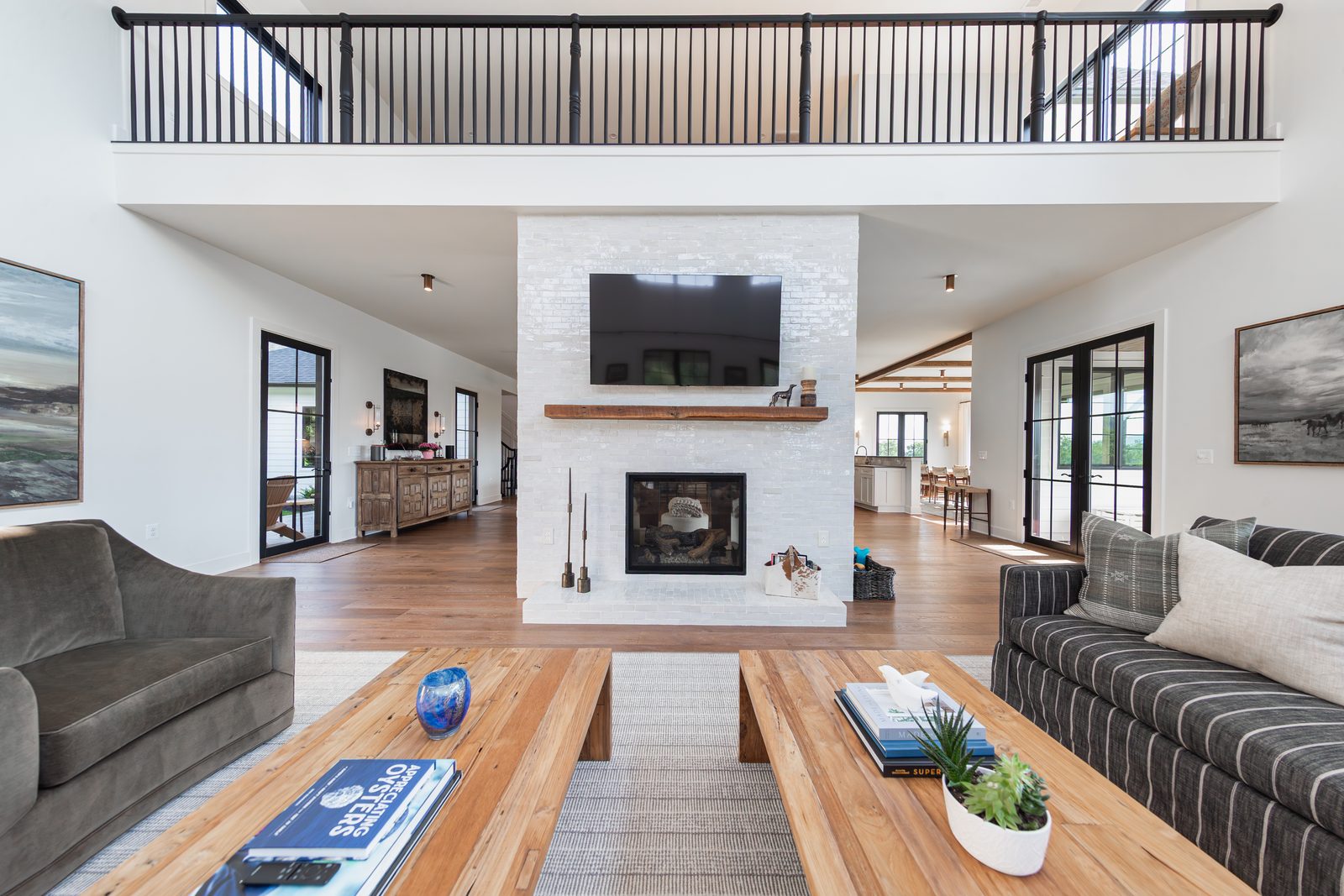 The family room with a white brick fireplace
