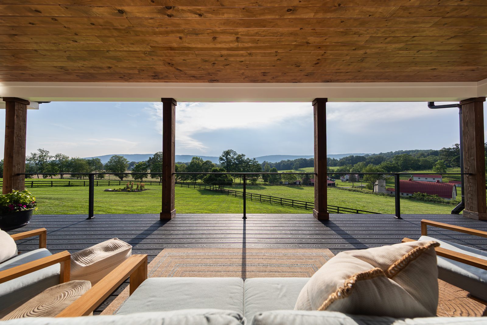 The view from the covered porch across the fields