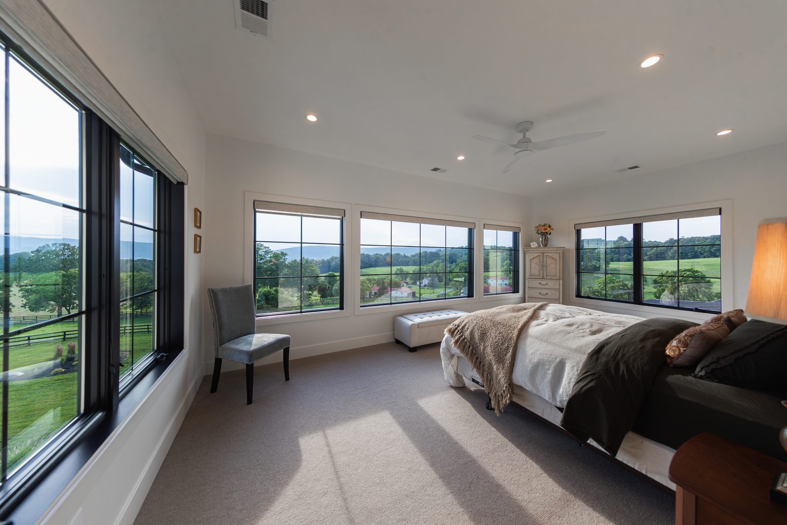 A bedroom with windows on two sides