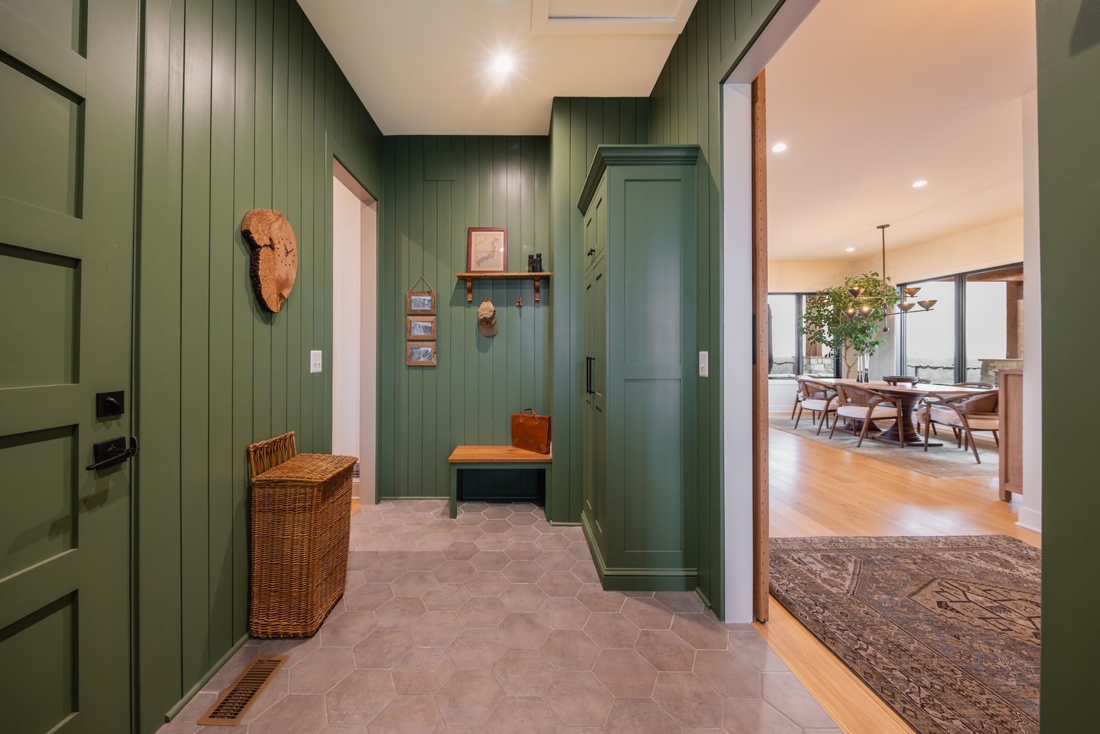 The green mudroom with built-in lockers