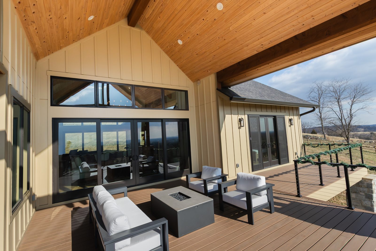 The covered deck, with tall windows into the great room