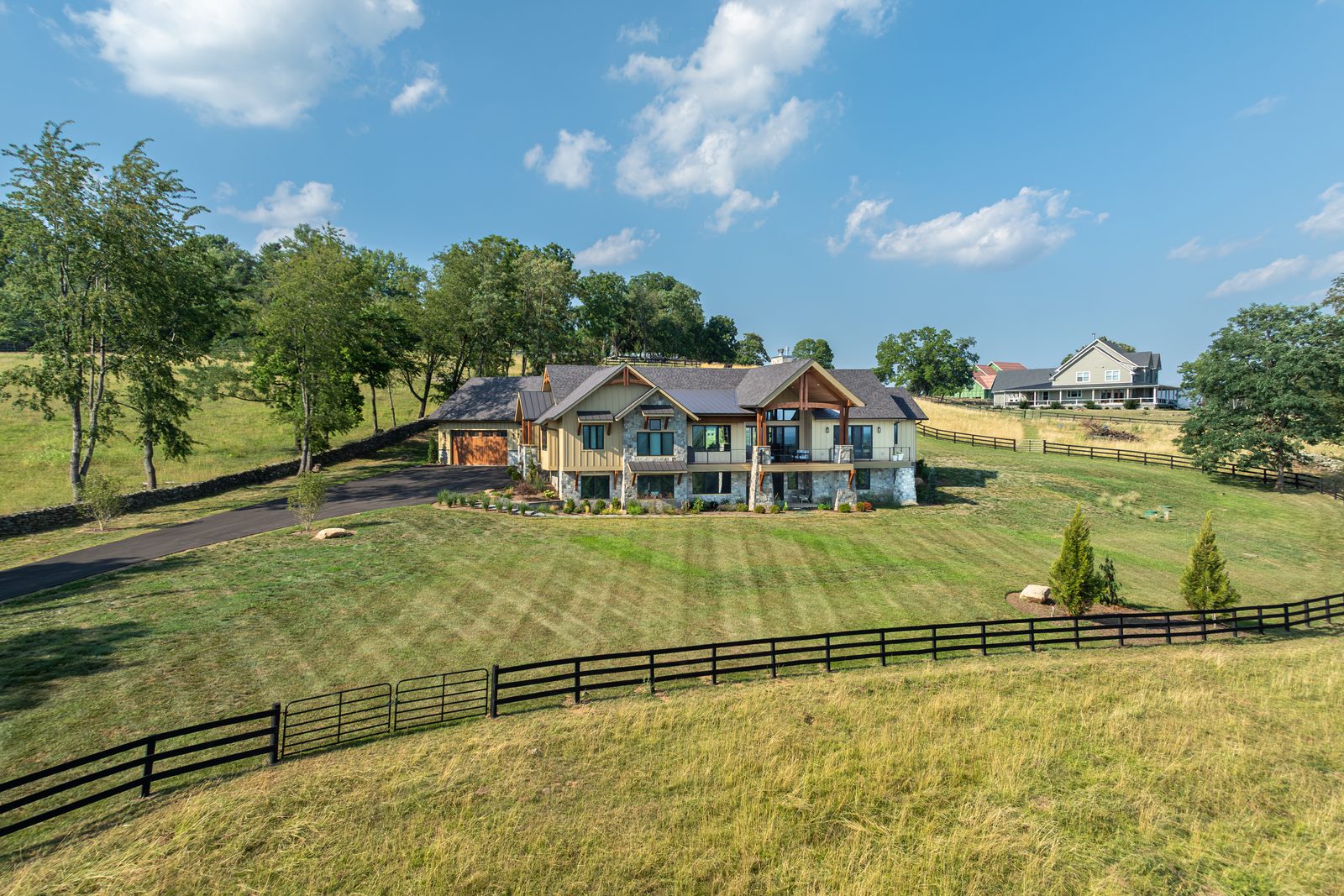 Mountain Craftsman from the air, behind its post-and-rail fence